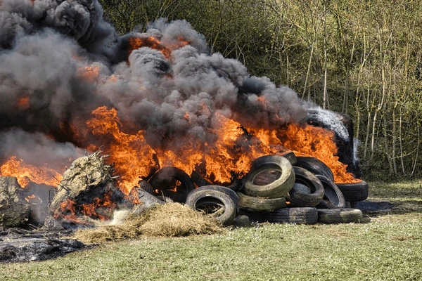 burning-landscape-vehicle-tires-haystacks-600nw-2143288939